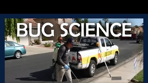 bug science employee in front of truck